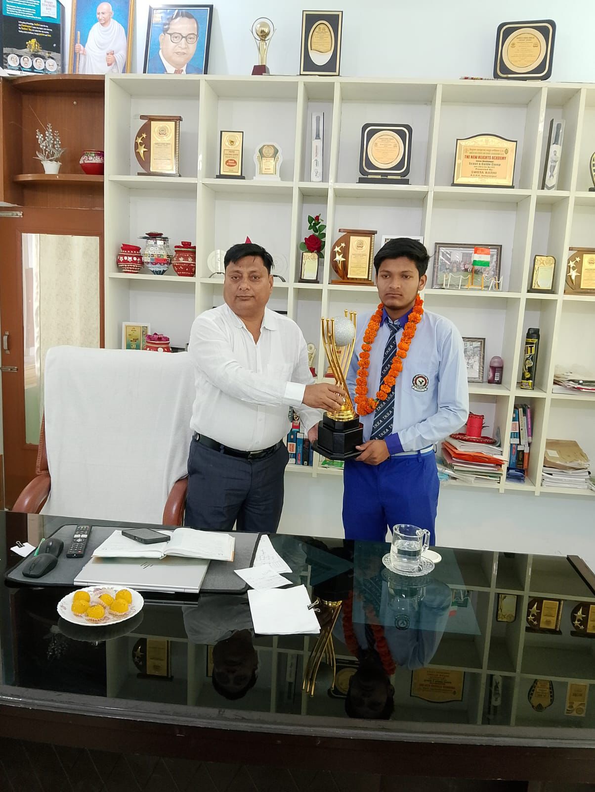 TNHA students celebrating results with trophies